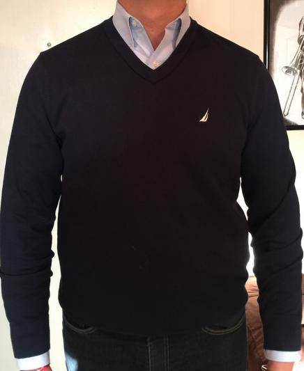 Worn over a button down shirt
