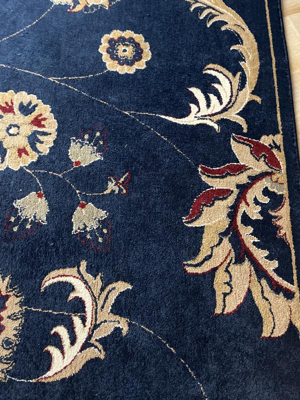 Beautiful entry rug matches our larger living room area rug.