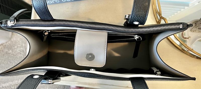 Zippered area can hold a laptop, etc.