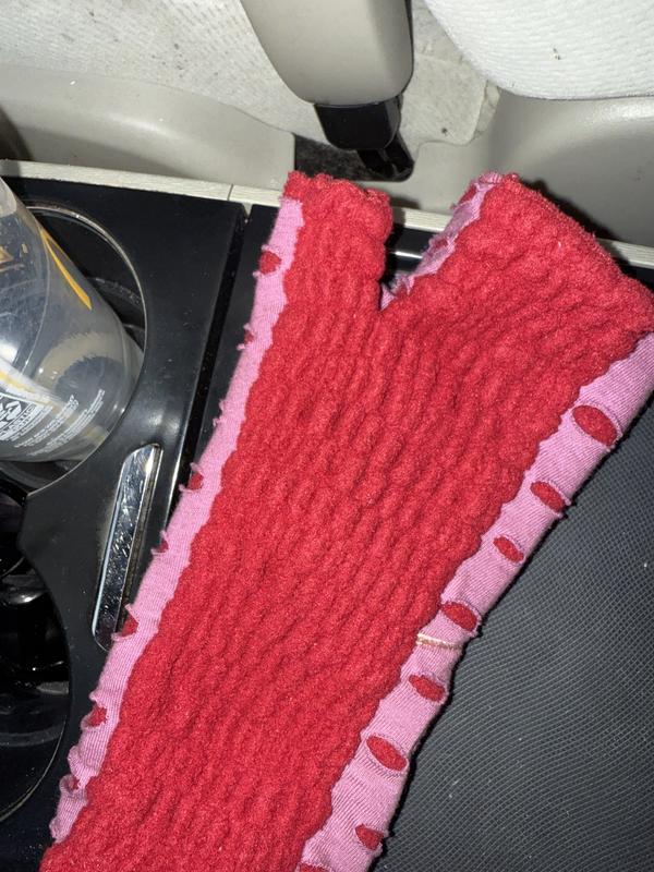 Red and mauve, edges look unfinished, bulky palm fabric