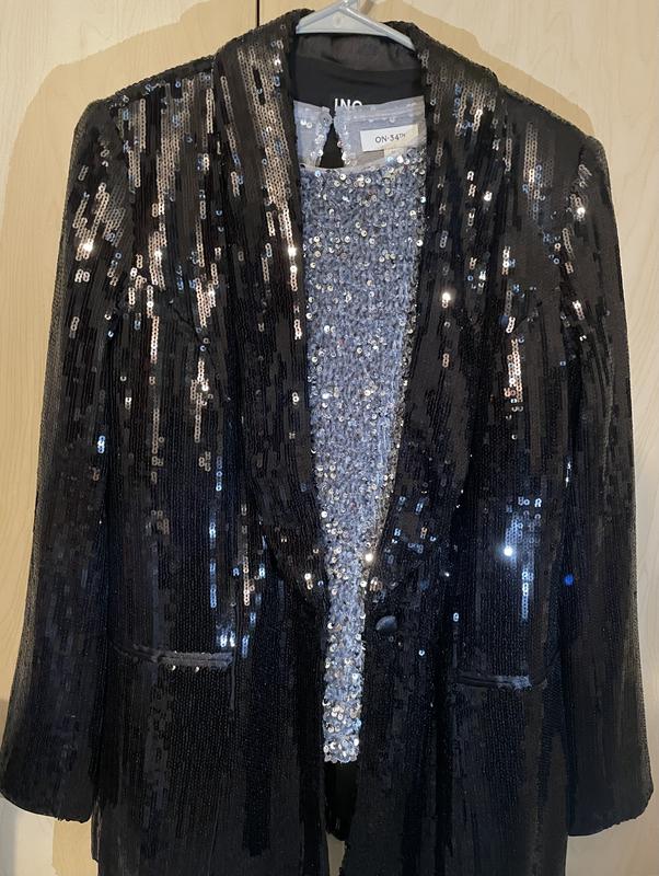 Shirt paired with a black sequin jacket