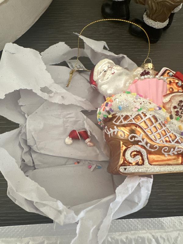 Santa’s hat and arm were broken off when it came out of the box.