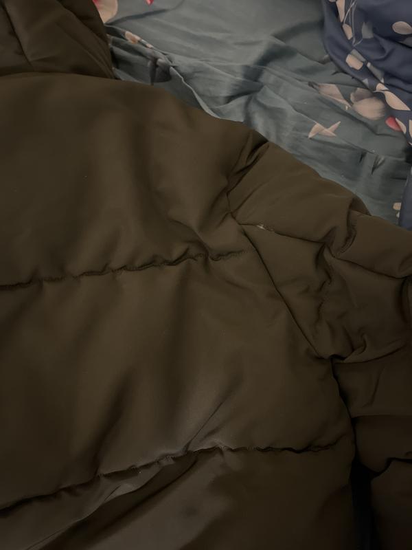 Torn stitch on right sleeve