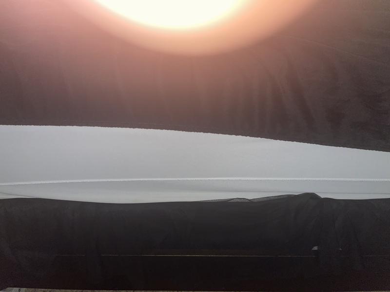 Made up bed with mattress pad