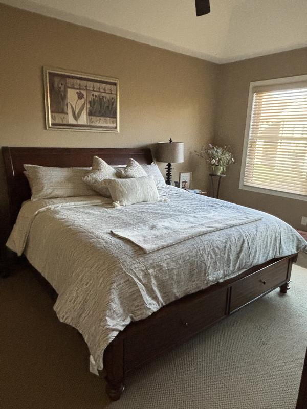 Extra pillows and throw added to dress up neutral comforter set