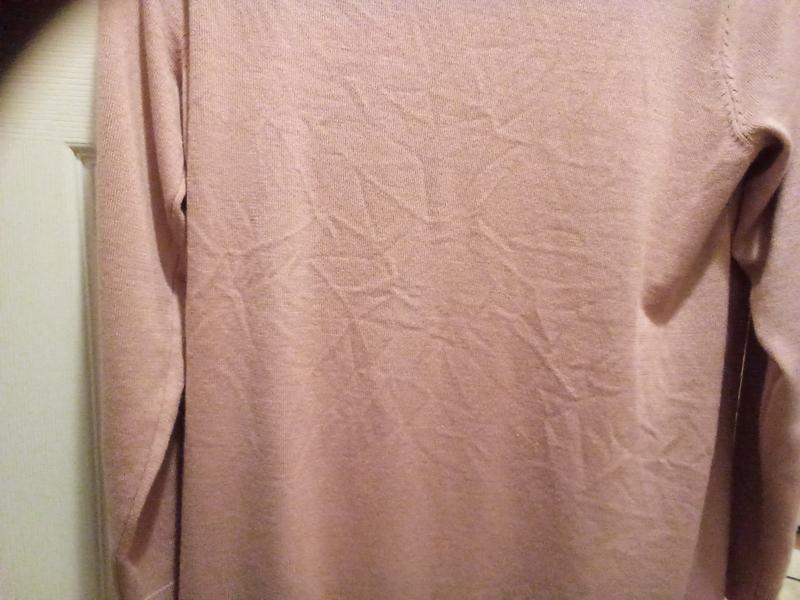 Very wrinkled, doesn't come out unless ironed