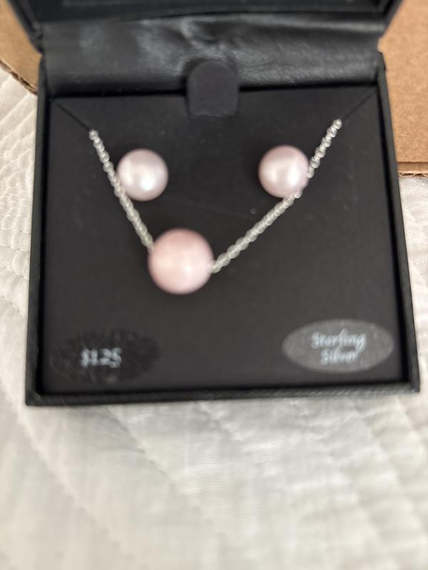 White earrings/somewhat pink necklace