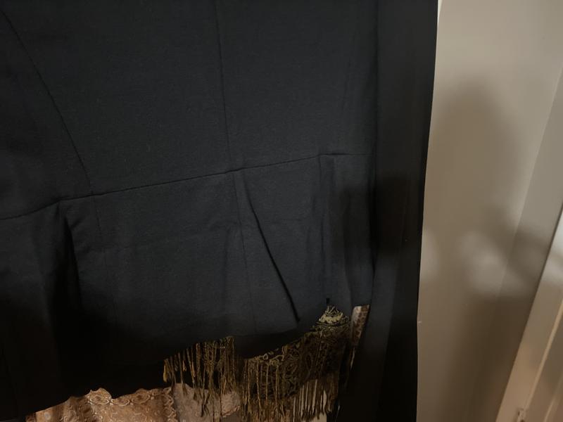 Flimsy at back and bottom of jacket. Not really black black.