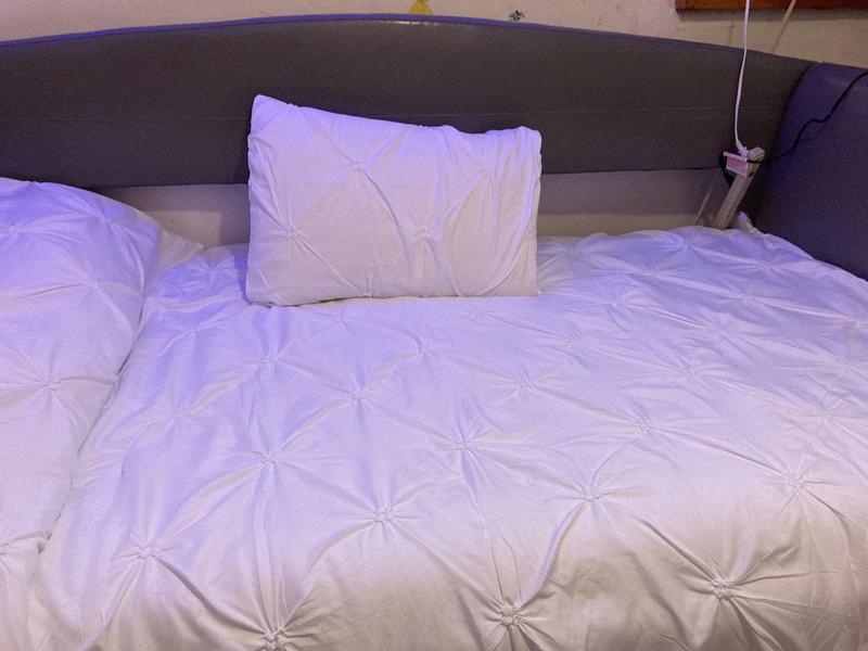 White comforter in guest room. We put color lights in the room and with the comforter it brighten the room