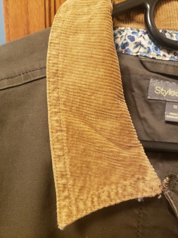 Jacket has square hem and can be cosed by zipper or snaps.love the trim on the collar and patch pockets.