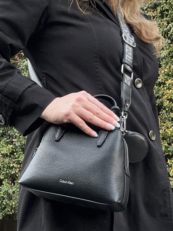 With the purse strap