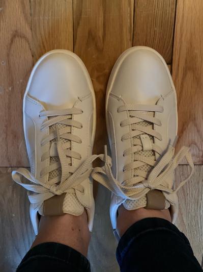 Looking down at shoes on, shoes pearly color