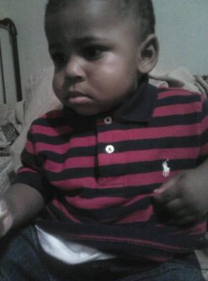 My son wearing his polo shirt