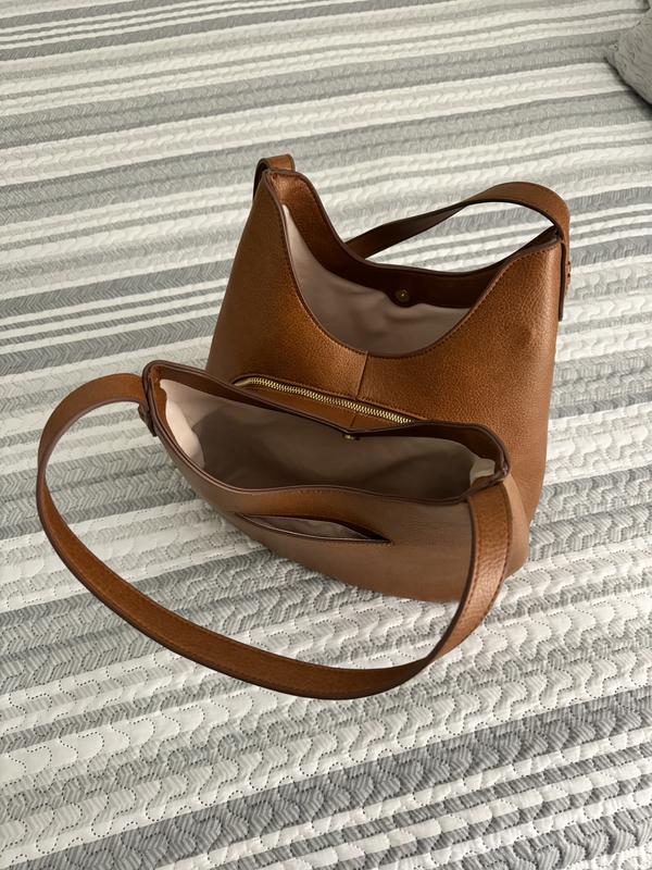 2 big pockets on the outside + cell phone pocket