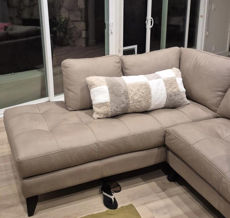 Bolster pillow compliments leather taupe couch