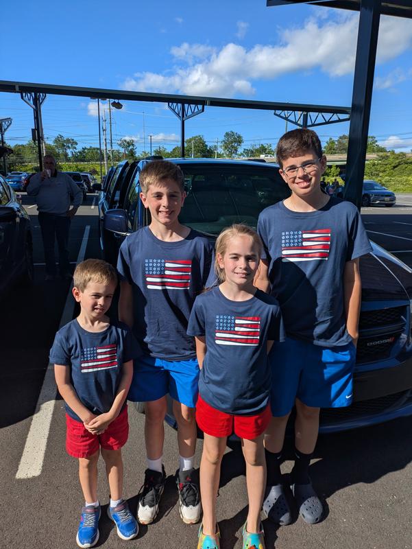 The grands wore their new t-shirts to a minor league baseball game in New Jersey.