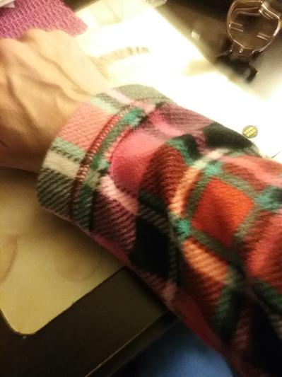 The sleeve fits longer when standing.