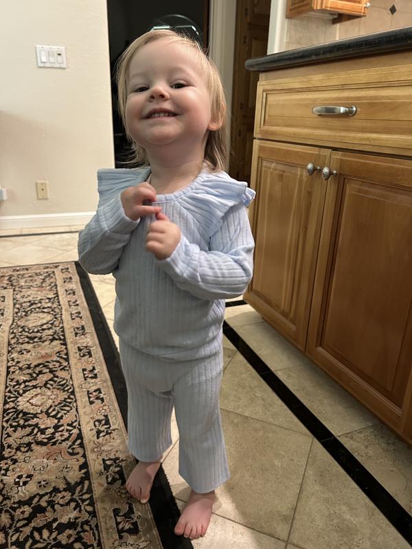 Granddaughter trying on the outfit.