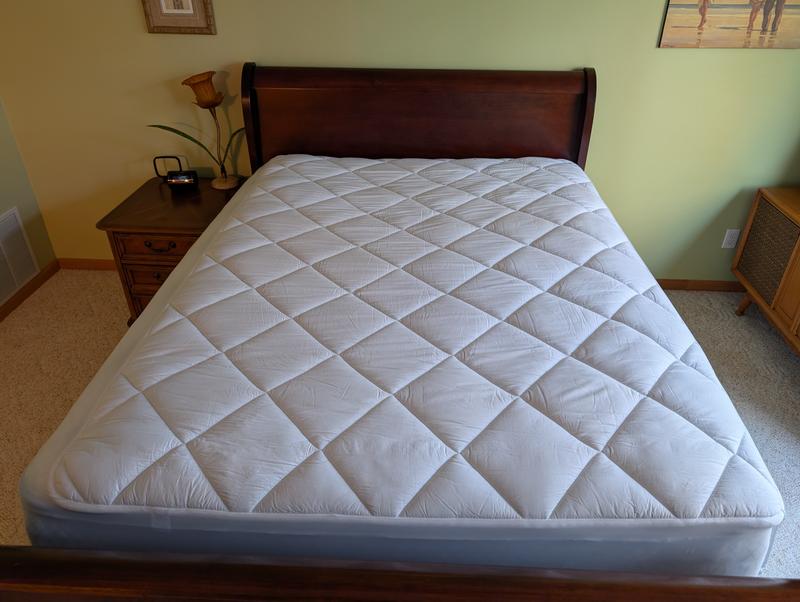Picture of the entire mattress. The mattress pad fits perfectly on the right side of the bed.