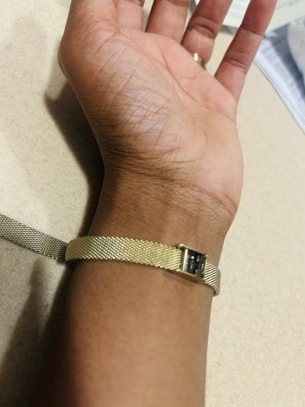 This is the adjustable clasp when it would not close. The small bar closest to my thumb side is where the clap is supposed to latch on, but it would not snap closed until I got it repaired.