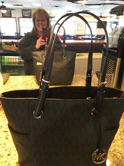 A selfie with her purse