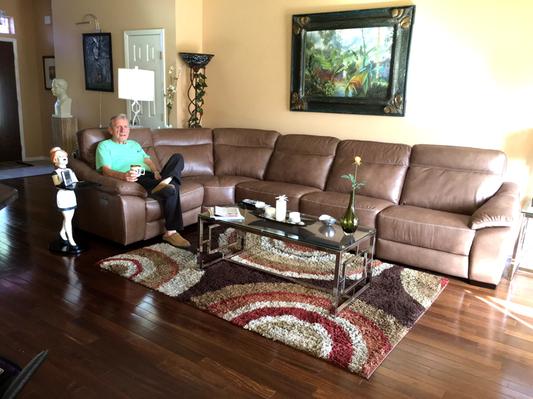 My husband relaxing on the beautiful sectional