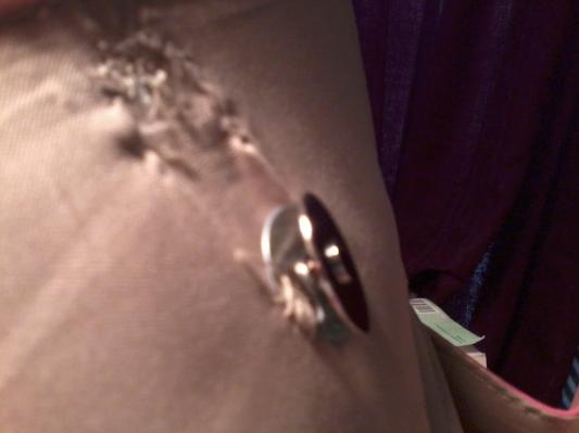 Refastened Magnetic Snap Side View with One Metal Bracken Broken