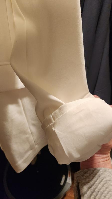Lined sleeves, so you can style the rolled up if you wish.