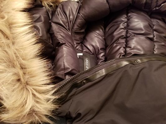 Faux fur trim, leather like trim and inside of coat.