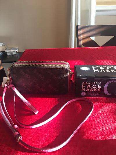 Next to a box of masks for size comparison