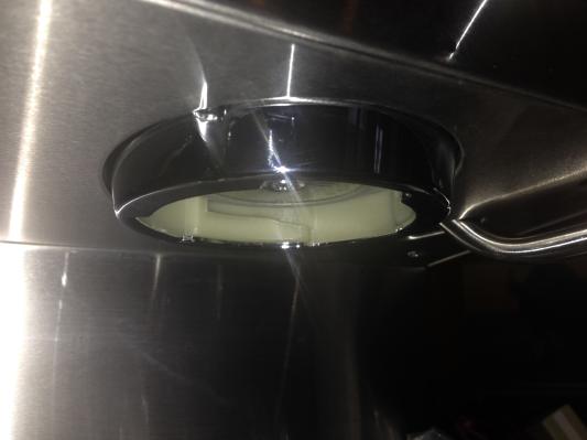 Chrome colored plastic outside, white plastic threads inside