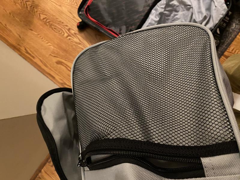 Duffle has one mesh and one solid side pocket - great for the gym