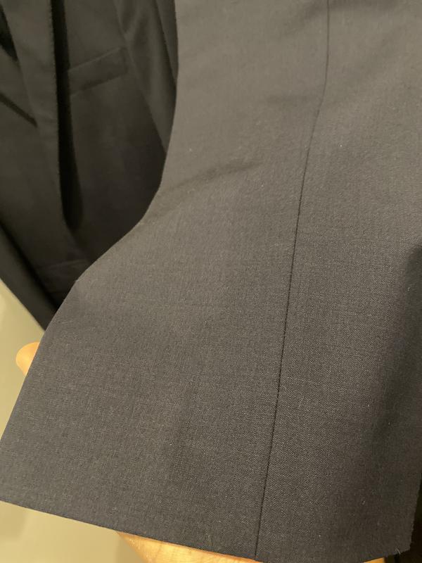 Up close of fabric on pants (hemming is good)