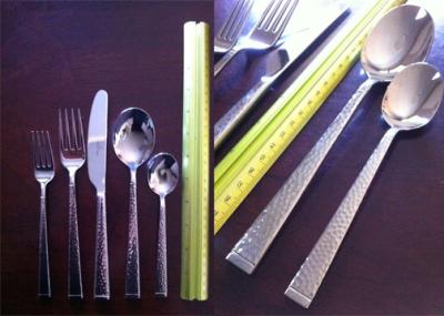 The dinner spoon is very large, almost the size of a serving spoon.