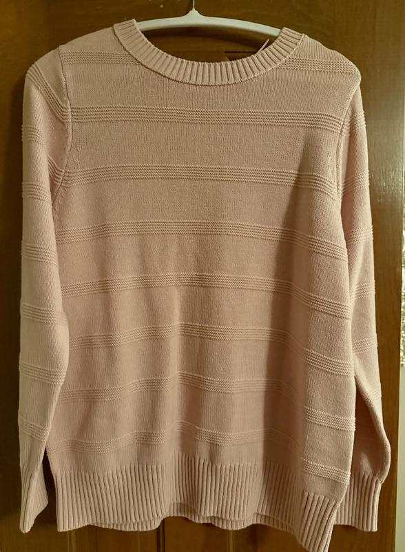 Showing picture of sweater hanging up