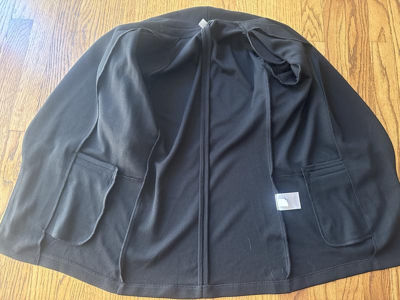 Unlined, faux pocket, shoulder pads