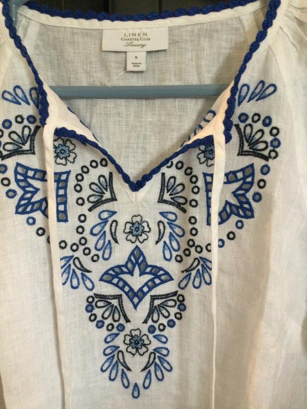Lovely embroidered detail, white linen material is crisp but not stiff