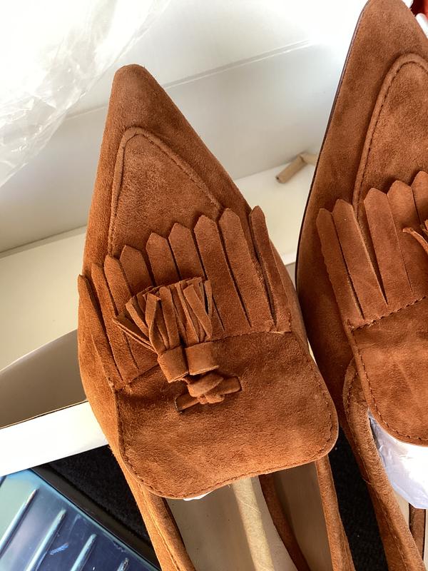 Left shoe has misaligned stitching & shape of cut of suede is off center. Poor quality check