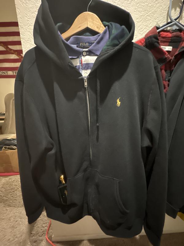 On a hanger with my favorite/ iconic striped Ralph Laure collared shirt.