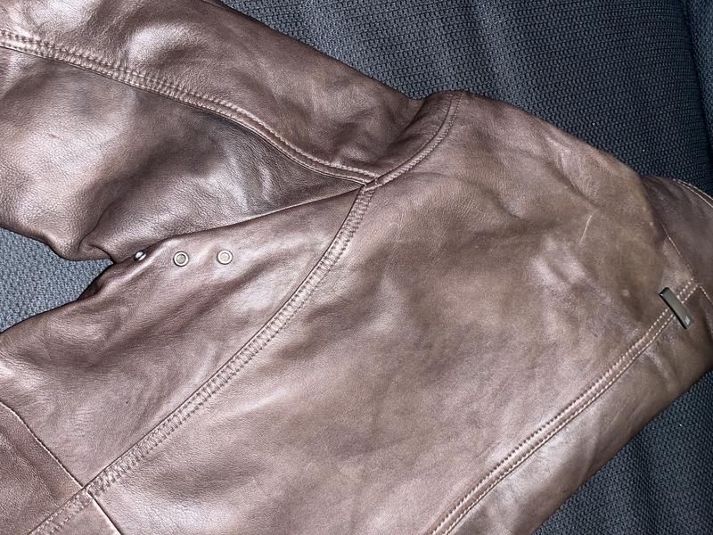 Backside grommets near sleeve