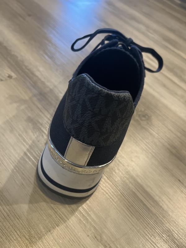 Unless your feet are extremely wide, the material will comfortably stretch for a nice fit.