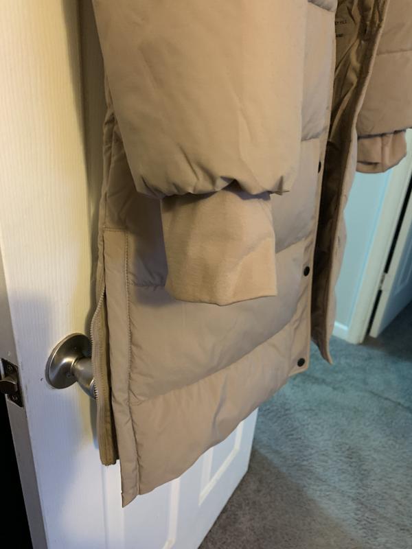 Front of coat back of coat cuff with thumb slit side zipper