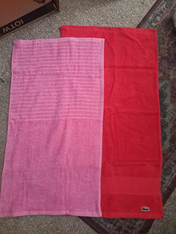 The pink towel is a hand towel & you can see the difference the red towelbi order is extra big & does not fit where it is suppose to go...