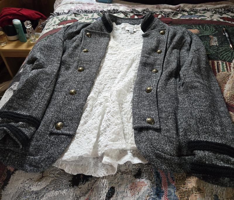 White top brought to wear underneath jacket