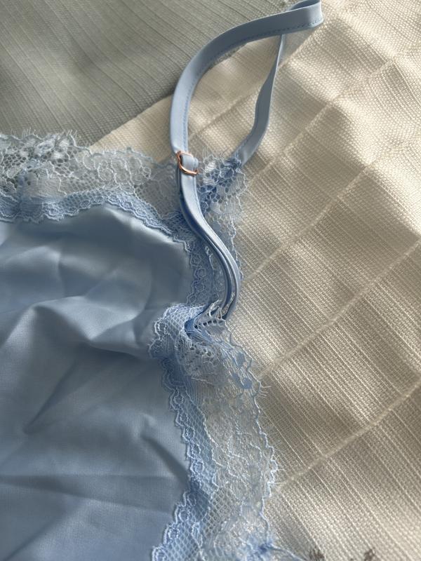 Adjustable straps and lace at the bottom.