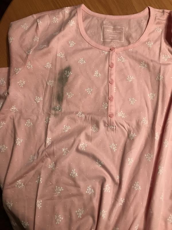 Side view/pocket, imprinted tag, tag in garment, received stained