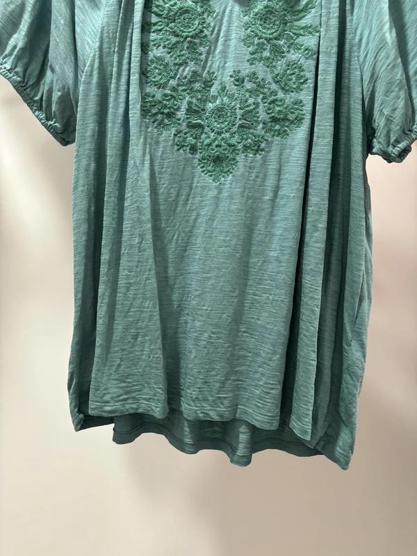 Has some really beautiful detailing. Back is a bit longer than the front as well. Great purchase.