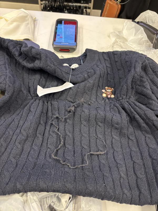 The sweater was delivered to my local Macy’s and luckily I opened the package there when picking it up and upon inspecting I see that the sweater was completed ruined and torn. I was able to return at that moment but wasn’t instock to repurchase