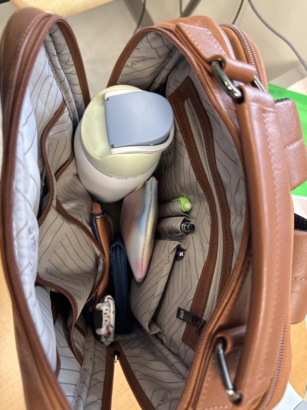 The big Owala, wallet, two makeup bags and other miscellaneous girly stuff.