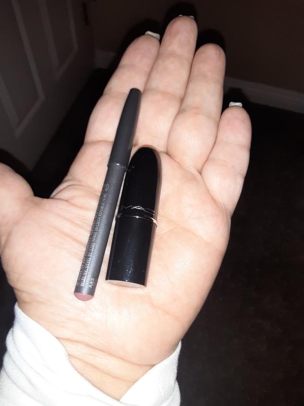 Smaller than the regular but you get alot of lipstick plus the lip liner.